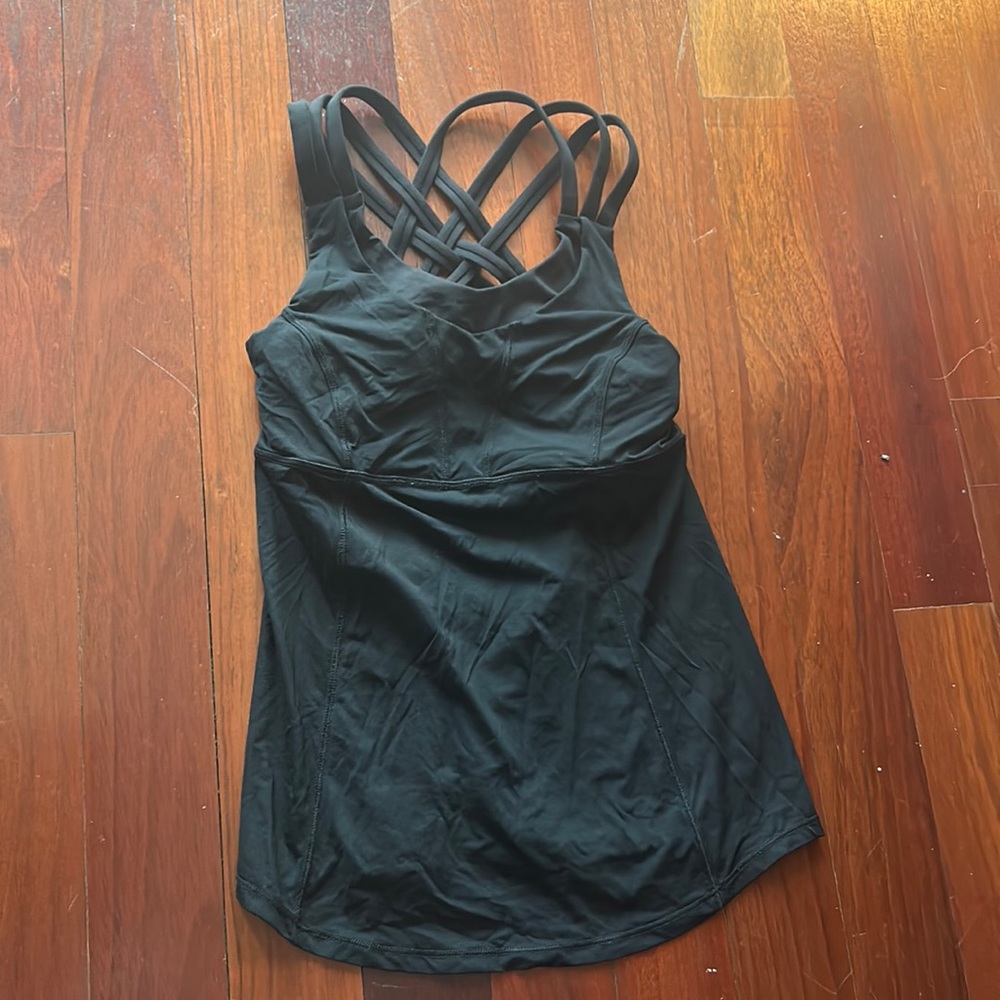Size 2 black lulu lemon top.